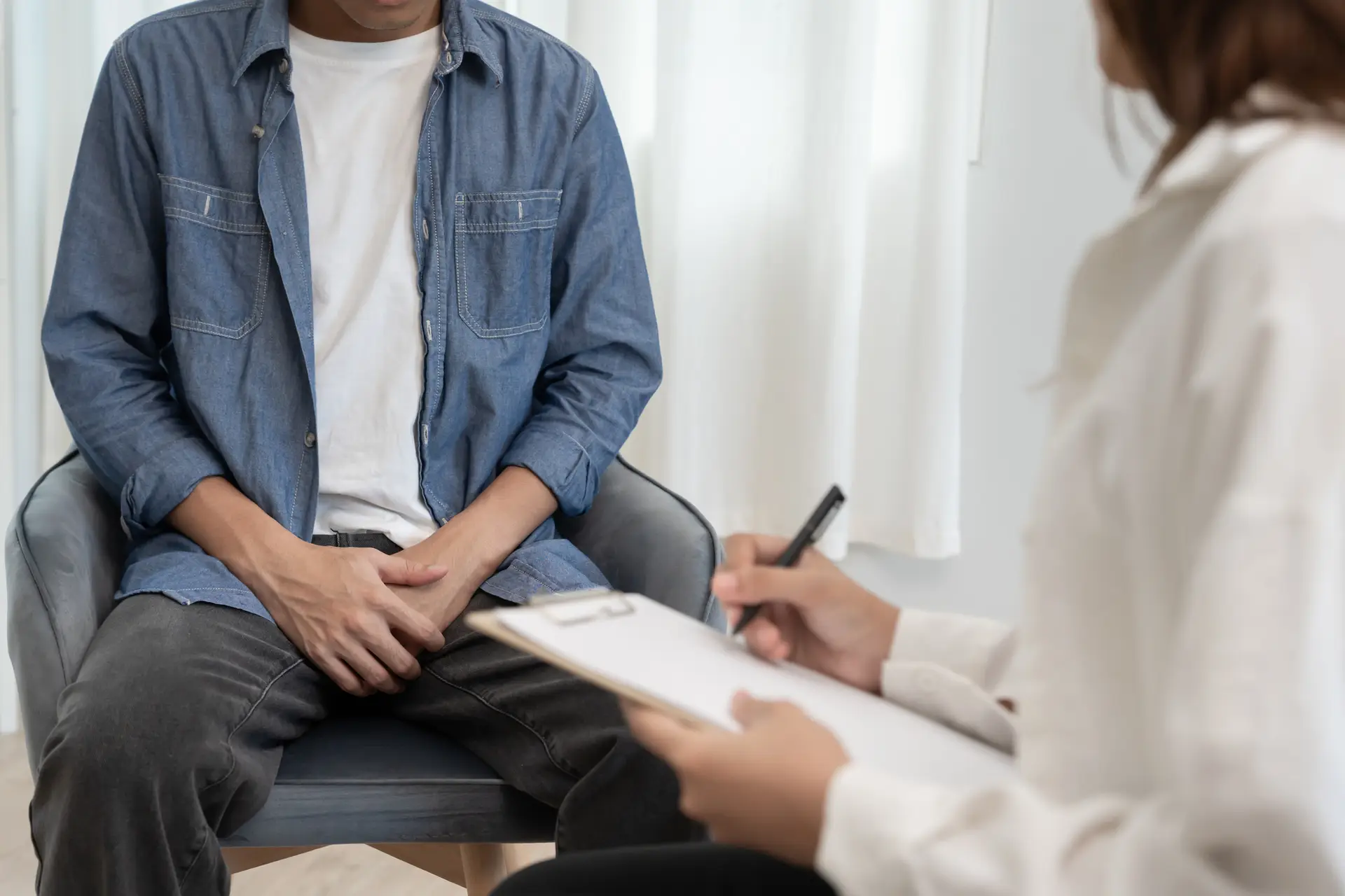 Man hold hand in front of private parts feeling discomfort and consult doctor. Venereal, testicular cancer. bladder problems, erectile dysfunction, premature ejaculation, prostate cancer