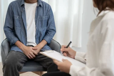 Man hold hand in front of private parts feeling discomfort and consult doctor. Venereal, testicular cancer. bladder problems, erectile dysfunction, premature ejaculation, prostate cancer